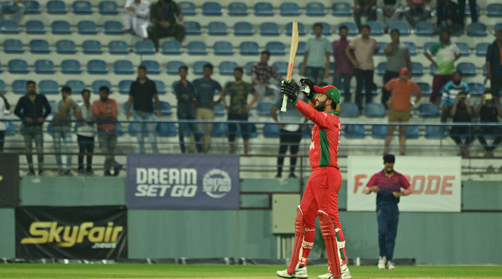 Ayaan Khan acknowledges cheers from the dugout upon reaching his half-century